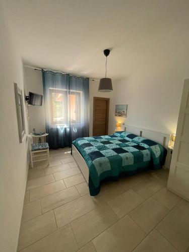 Ένα ή περισσότερα κρεβάτια σε δωμάτιο στο Dolce Luna Casa vacanza