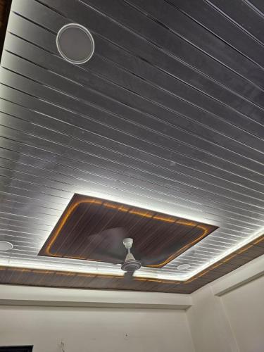 a skylight in the ceiling of a room at Walk to Temples in Chhatikara
