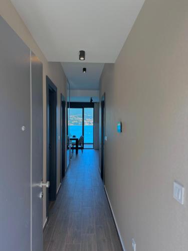 a hallway with a view of the ocean from a house at Azurno Pristaniste 1 in Njivice