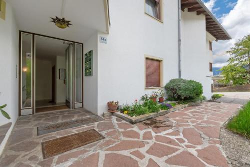 an entry to a house with a stone walkway at Apartment Stuflesser in Laion