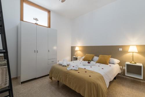 Ένα ή περισσότερα κρεβάτια σε δωμάτιο στο Home2Book Charming Rooftop Vibes Apartment