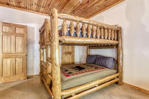 a bedroom with two bunk beds in a room at Cades Cove Escape By Avada Properties in Townsend
