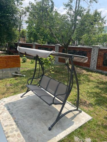 a chair sitting on the ground in a yard at Typebi in K'obulet'i
