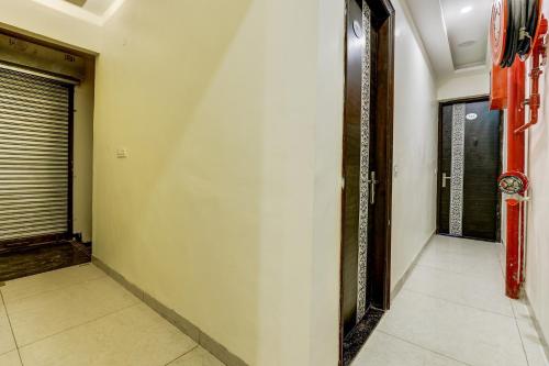 a corridor of a room with a door at Hotel O La Vista in Zirakpur