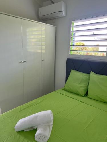 Postel nebo postele na pokoji v ubytování La Palmeraie Du Levant