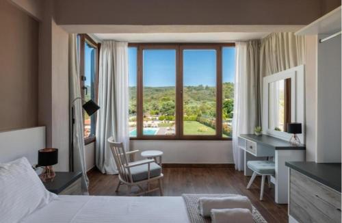 Кровать или кровати в номере Arteon villas