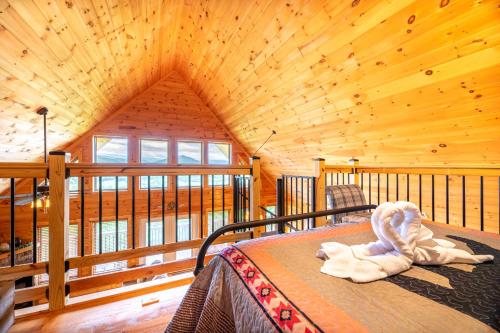 a bedroom with a bed in a log cabin at Starry Night Retreat By Avada Properties in Sevierville