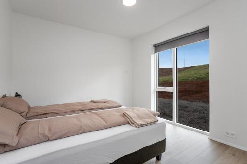 Voodi või voodid majutusasutuse 3BR Modern & Spacious Golden Circle Home toas