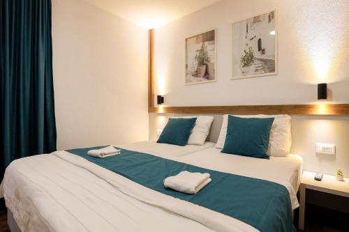 Postel nebo postele na pokoji v ubytování Apartments Zovko