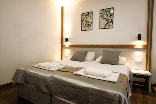 Postel nebo postele na pokoji v ubytování Apartments Zovko