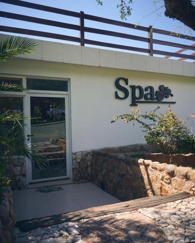 a spago sign on the side of a building at Los Ancares Resort in Mina Clavero