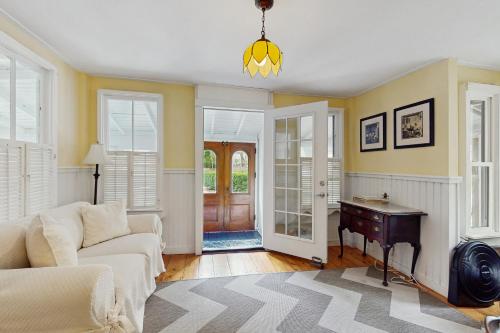 a living room with a couch and a table at Beach House in Oak Bluffs