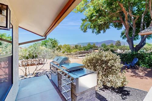 a grill on the patio of a house at Casa Del Cielo in Cottonwood