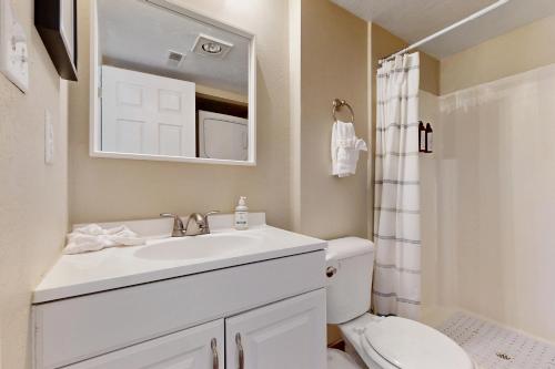 a bathroom with a white sink and a toilet at New Claim Condominiums 114 in Park City
