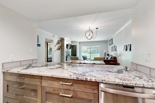 a kitchen with a large marble counter top at Park Station Elegance 210 in Park City