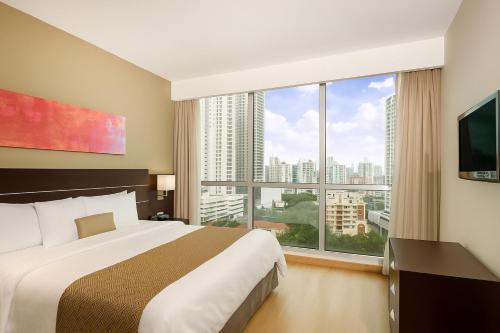 Llit o llits en una habitació de Tryp by Wyndham Panama Centro