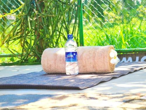 a bottle of water sitting on top of a towel at Villa Svara in Kosgoda