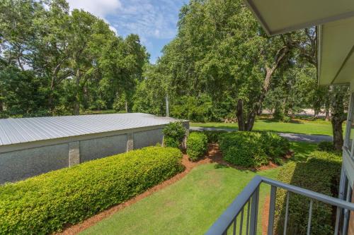 a view of a yard from a balcony of a house at Sea Palms Colony 240D in Glynn Haven