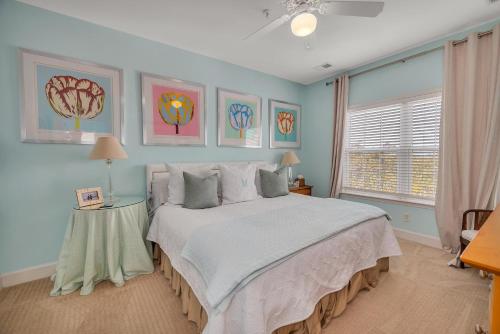 a bedroom with a large bed and a window at Windward Point 210 in Harrington