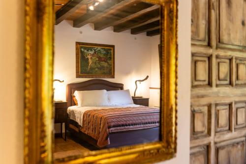a mirror reflection of a bed in a bedroom at Villa Cannamele in Carini