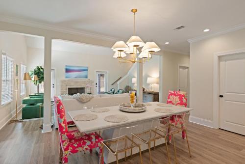 a dining room and living room with a table and chairs at 23 Orchard Rd in Island Retreat