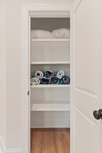 a closet filled with lots of shoes at 23 Orchard Rd in Island Retreat