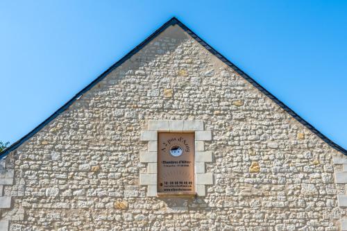 a building with a window on the side of it at A 2 pas d AZAY in Neuil