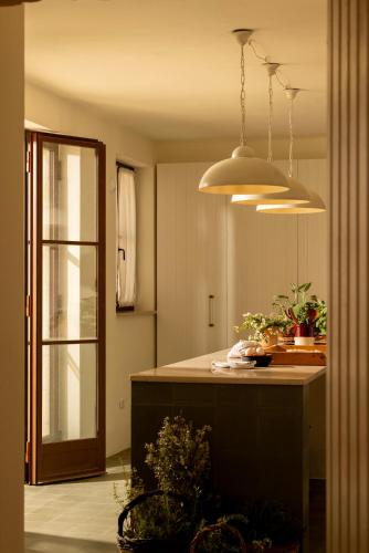 a kitchen with a island with a counter top at Masseria Tarsia Morisco in Polignano a Mare