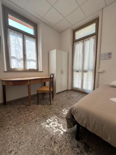 Ένα ή περισσότερα κρεβάτια σε δωμάτιο στο foresteria ca' mon