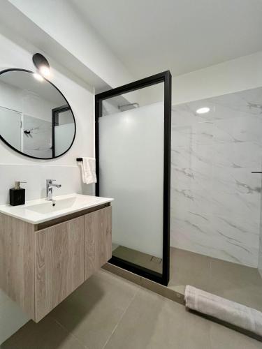 a bathroom with a sink and a mirror at Beautiful cozy apartment in Cusco