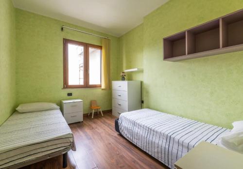 Ένα ή περισσότερα κρεβάτια σε δωμάτιο στο Villetta Norma - Free Wifi
