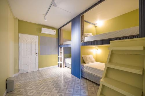 Ένα ή περισσότερα κρεβάτια σε δωμάτιο στο 113 Yellow House Hostel