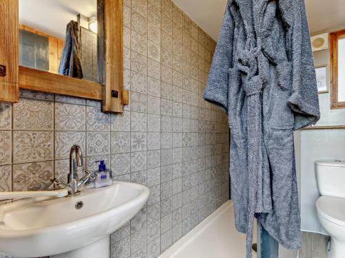 a bathroom with a sink and a toilet at 1 Bed in Hartington 93565 in Hartington