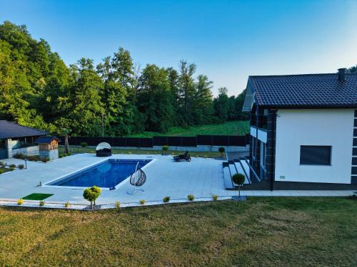 an overhead view of a backyard with a swimming pool at Villa La Casa Del Sol in Srebrenik