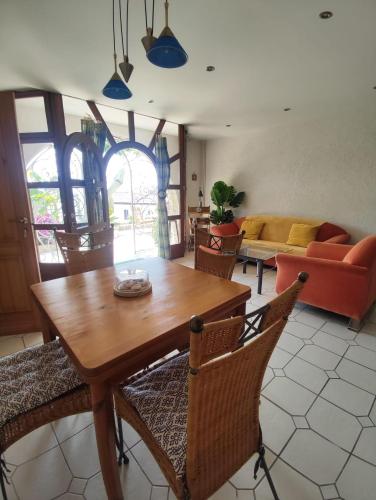 a living room with a wooden table and chairs at Apartments Mihael in Celina