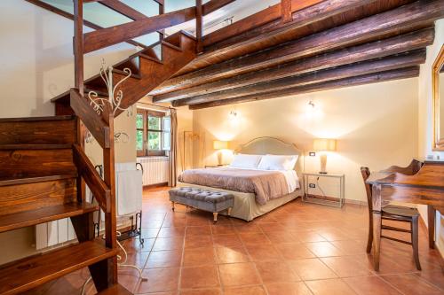 a bedroom with a large bed and a piano at La Collina dei Nebrodi in San Marco dʼAlunzio
