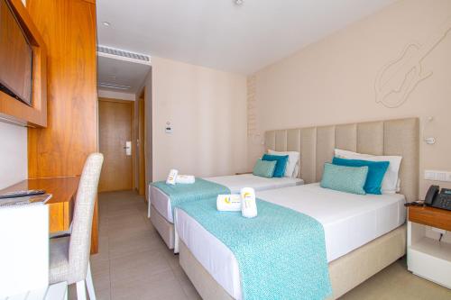 Postel nebo postele na pokoji v ubytování Luna Boutique Hotel