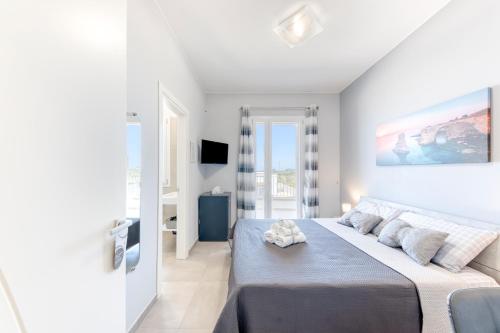 a bedroom with a large bed in a room at Villa dei due mari in Morciano di Leuca