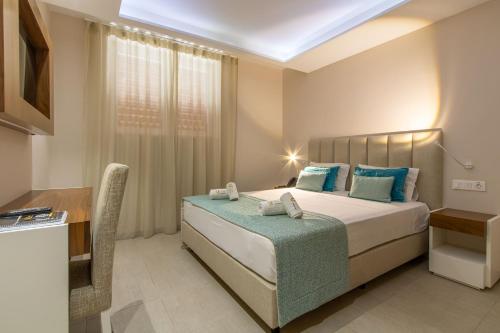 Postel nebo postele na pokoji v ubytování Luna Boutique Hotel