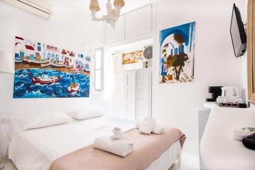 Ένα ή περισσότερα κρεβάτια σε δωμάτιο στο Hotel Delfines