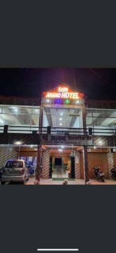 a car parked in front of a gas station at night at Shri Anand Hotel Berinag Shahgram with Parking included in Berināg