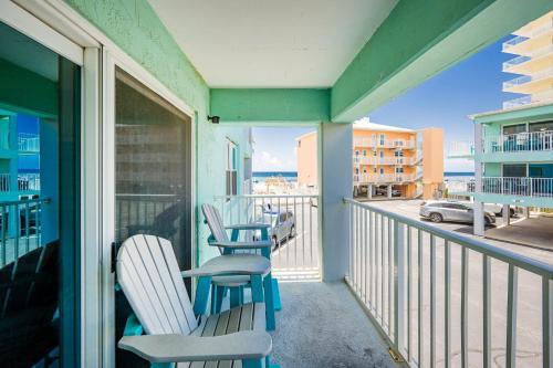 a balcony with chairs and a view of the ocean at Harbor House B19 condo in Gulf Shores