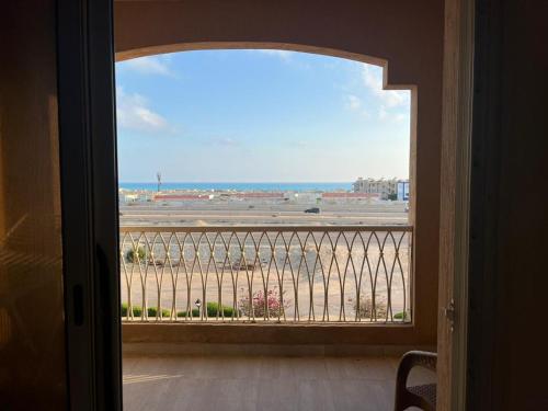 a view of the ocean from a room with a window at Sea view apartment, Aqua View Resort, North coast in El Alamein
