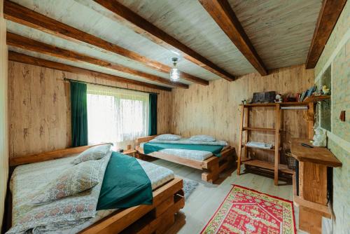 Katil atau katil-katil dalam bilik di Cabana Cuib De Soim 2