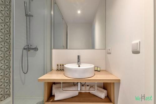 a bathroom with a sink and a shower at Louis Vicat 6 - CI - Ideal apartment for 4 Paris Expo Porte de Versailles in Paris