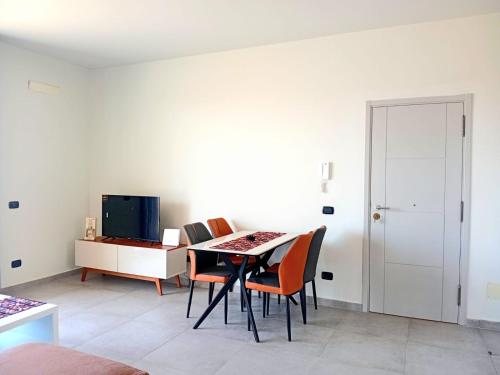 a dining room with a table and chairs at Sal Rei apartaments, Boa Vista, free WI-FI in Sal Rei