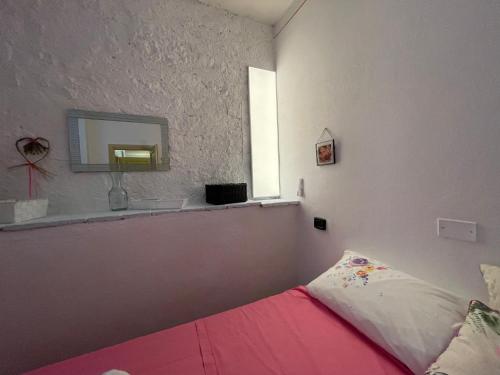 Ένα ή περισσότερα κρεβάτια σε δωμάτιο στο Villa immersa nella Serenità