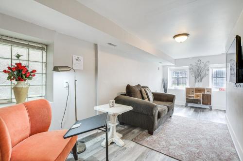 a living room with a couch and a table at Dog-Friendly Apt with Yard 10 Mi to Downtown in Chicago
