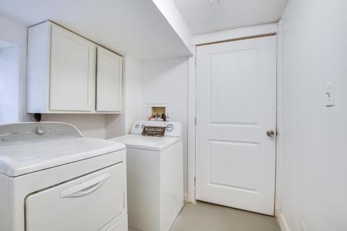 a white laundry room with a washer and dryer at Dog-Friendly Apt with Yard 10 Mi to Downtown in Chicago