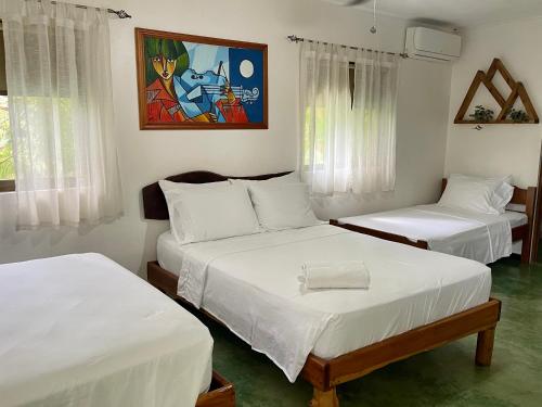 Postel nebo postele na pokoji v ubytování Villas Jacquelina